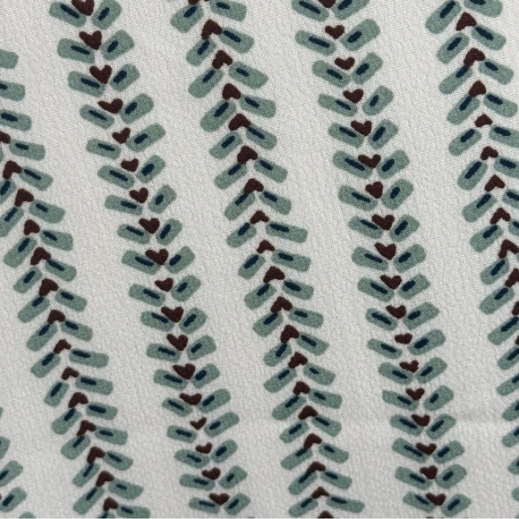 V-Neck Sleeveless Blouse with green and red pattern. - Picture 5 of 7